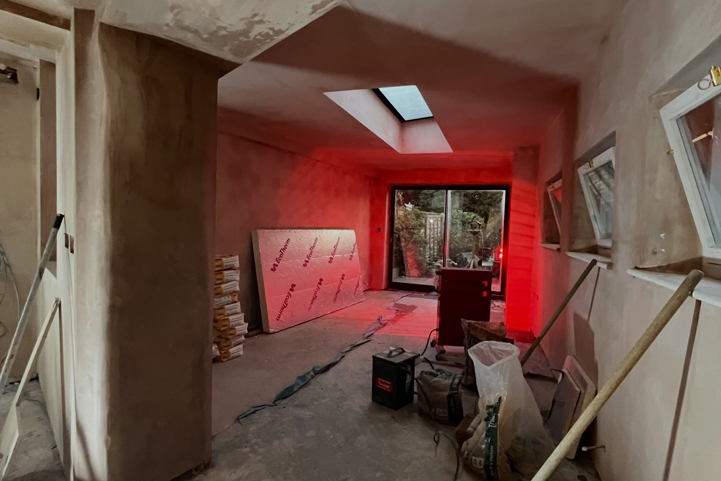 A freshly skimmed room with a rooflight, ready for decorating