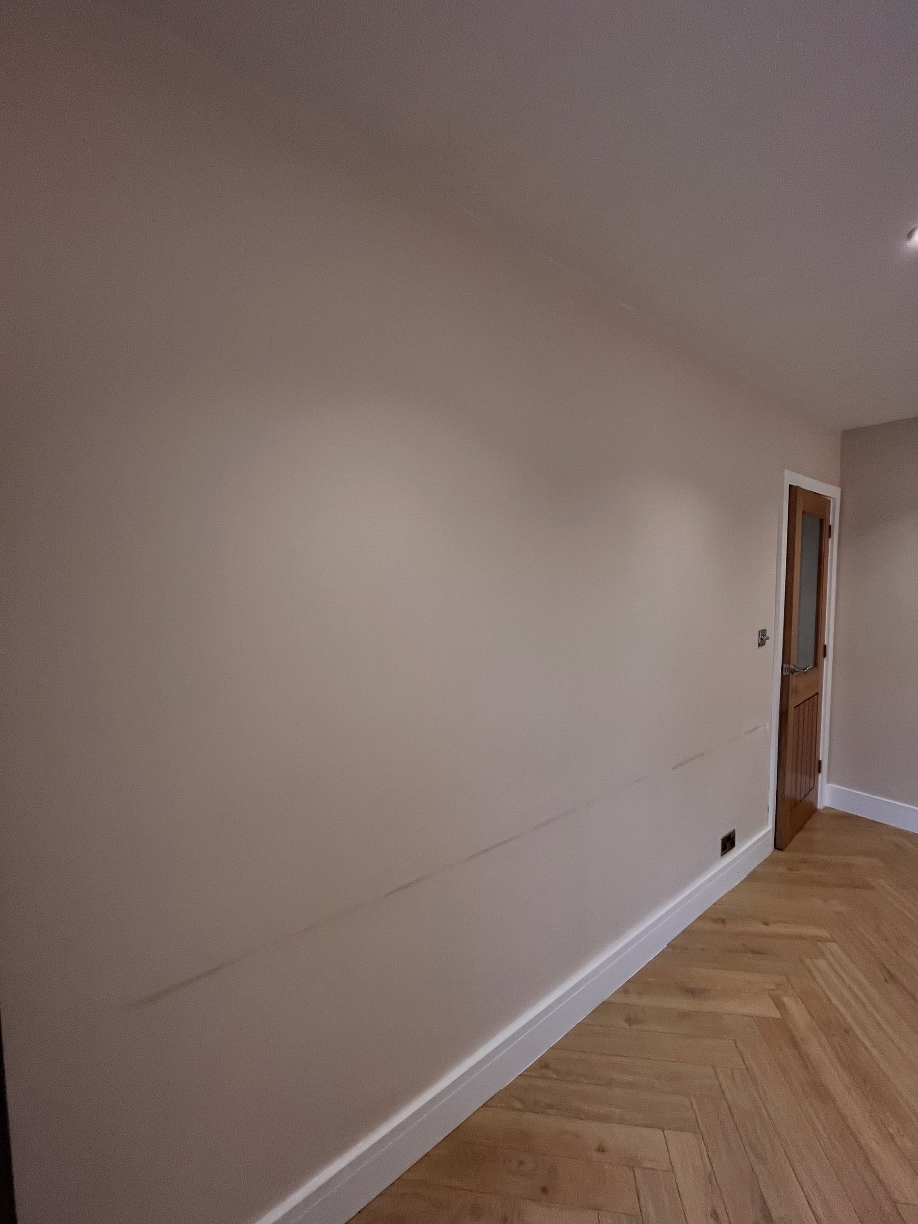 The plain wall from another angle before the Venetian plaster
